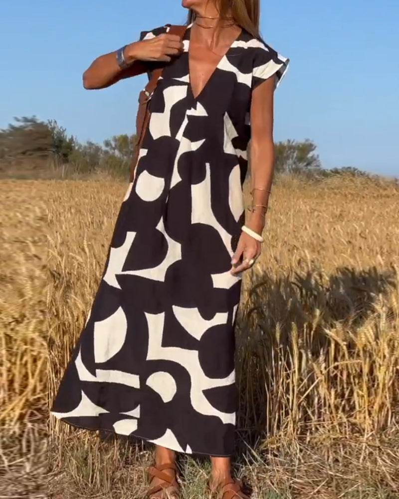 SITA - Dress with print and V-neckline