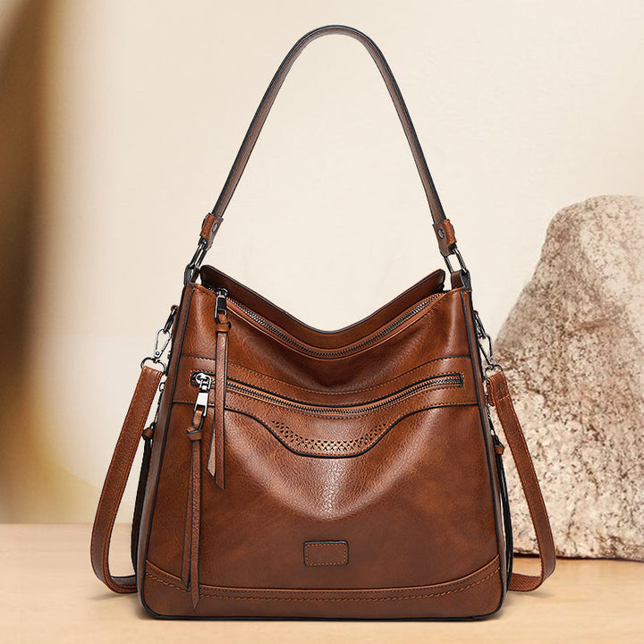 Malbjørg | Elegant shoulder bag with a wavy design